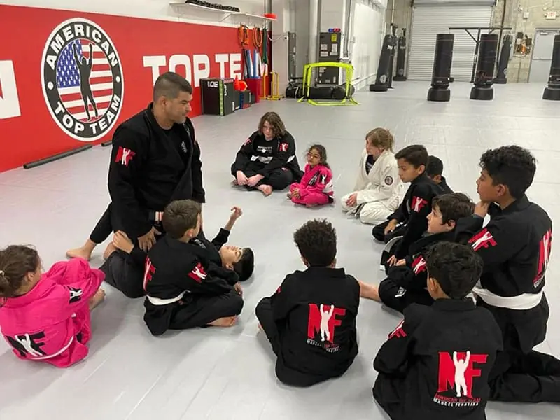 Older kids training Brazilian Jiu-Jitsu technique at ATT Winter Garden