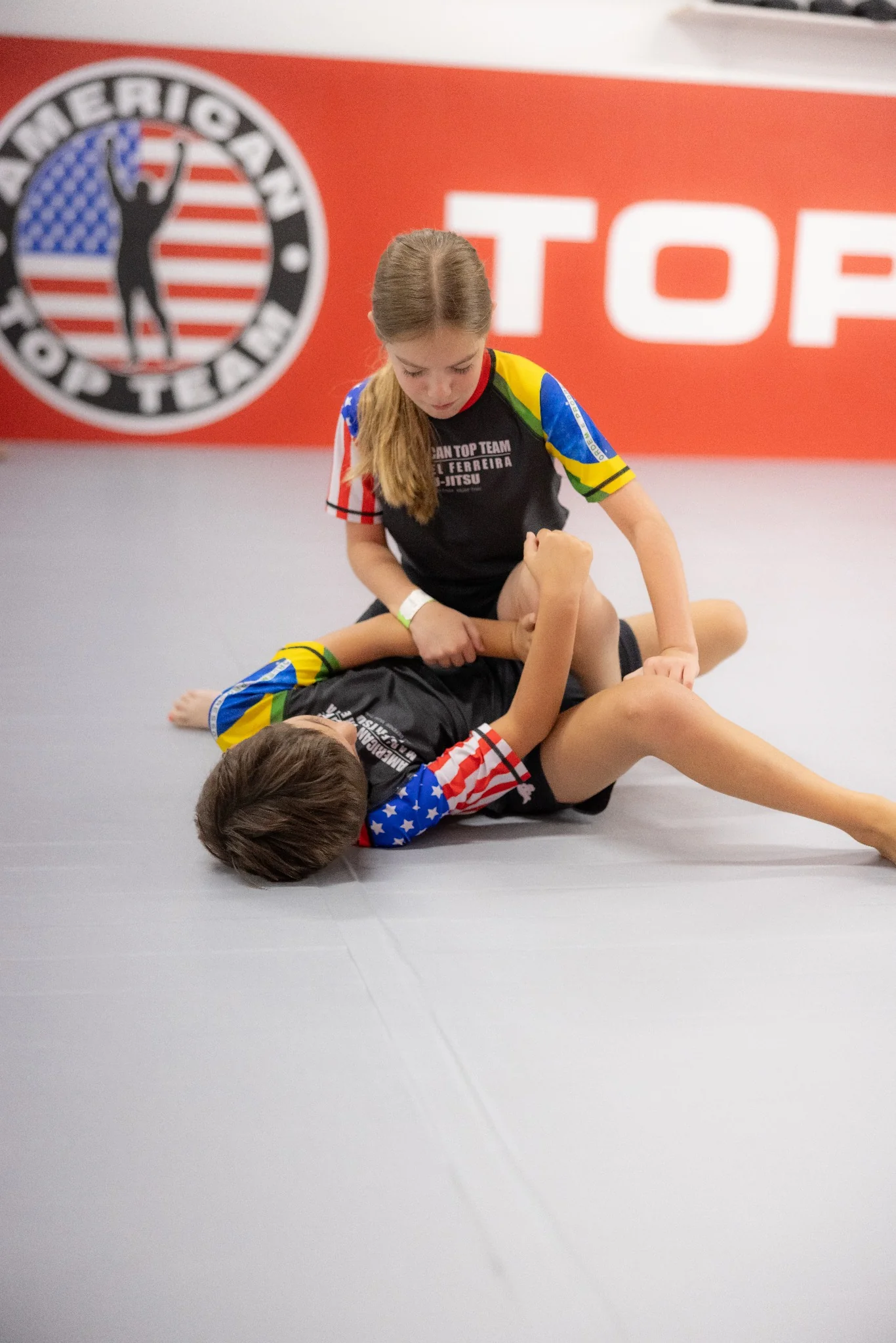 Young kids in gis learning Brazilian Jiu-Jitsu at ATT Winter Garden